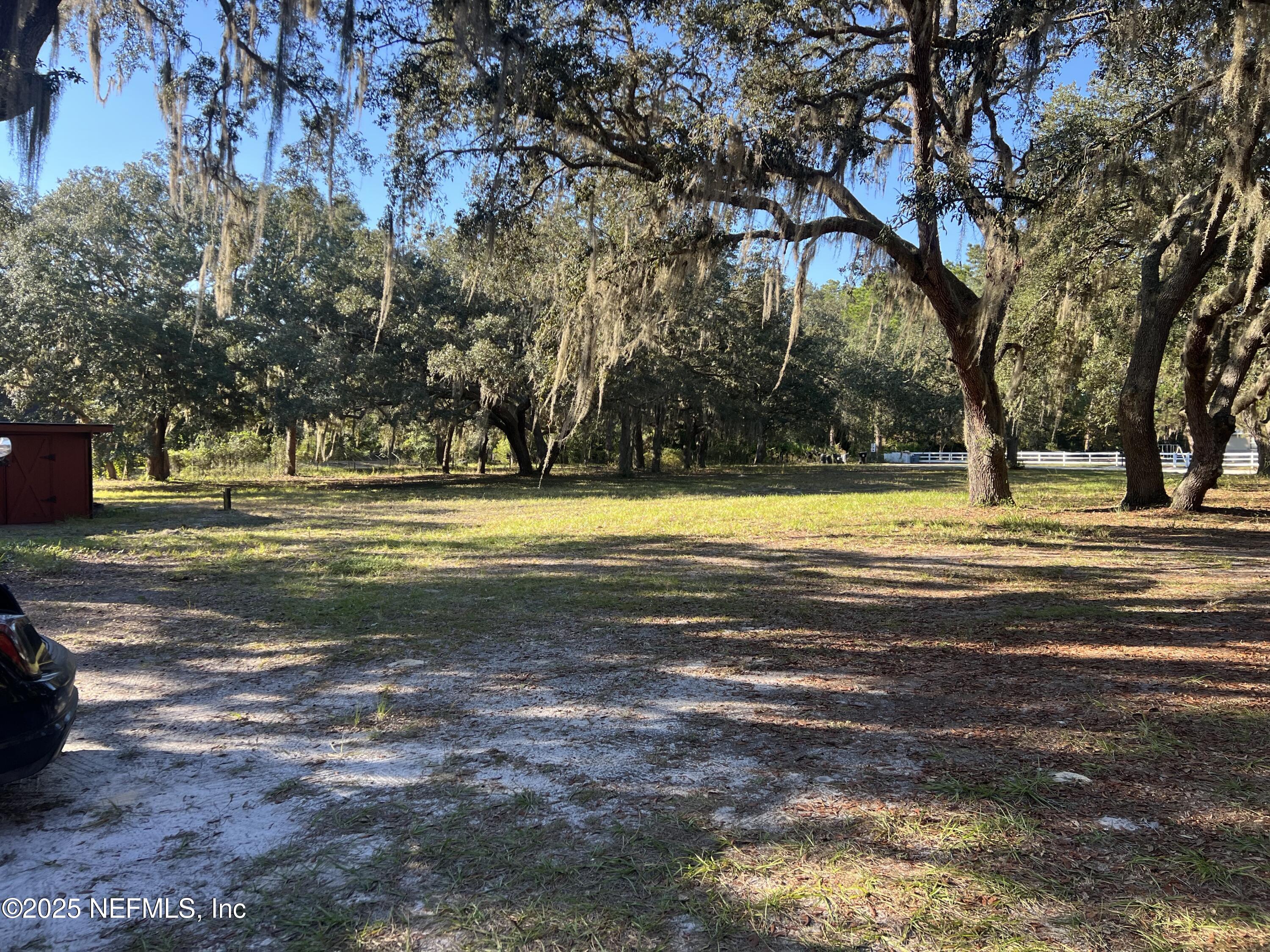 159 Keystone Road Palatka, FL 32177 - Photo 2 of 36 a view of a swimming pool with a yard and trees