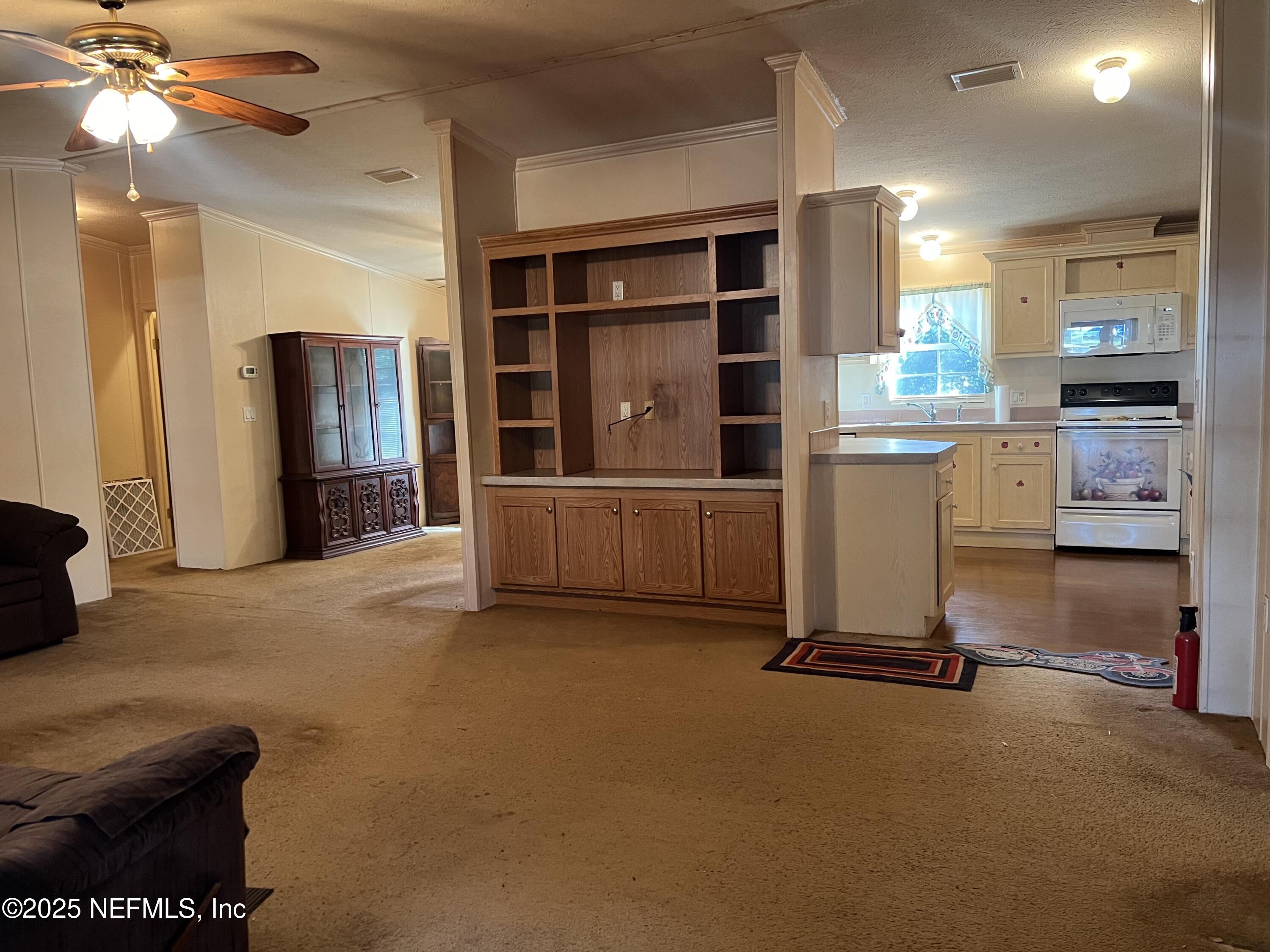 159 Keystone Road Palatka, FL 32177 - Photo 21 of 36 a view of a livingroom with furniture and a window