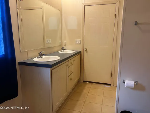 a bathroom with a tub a sink and toilet