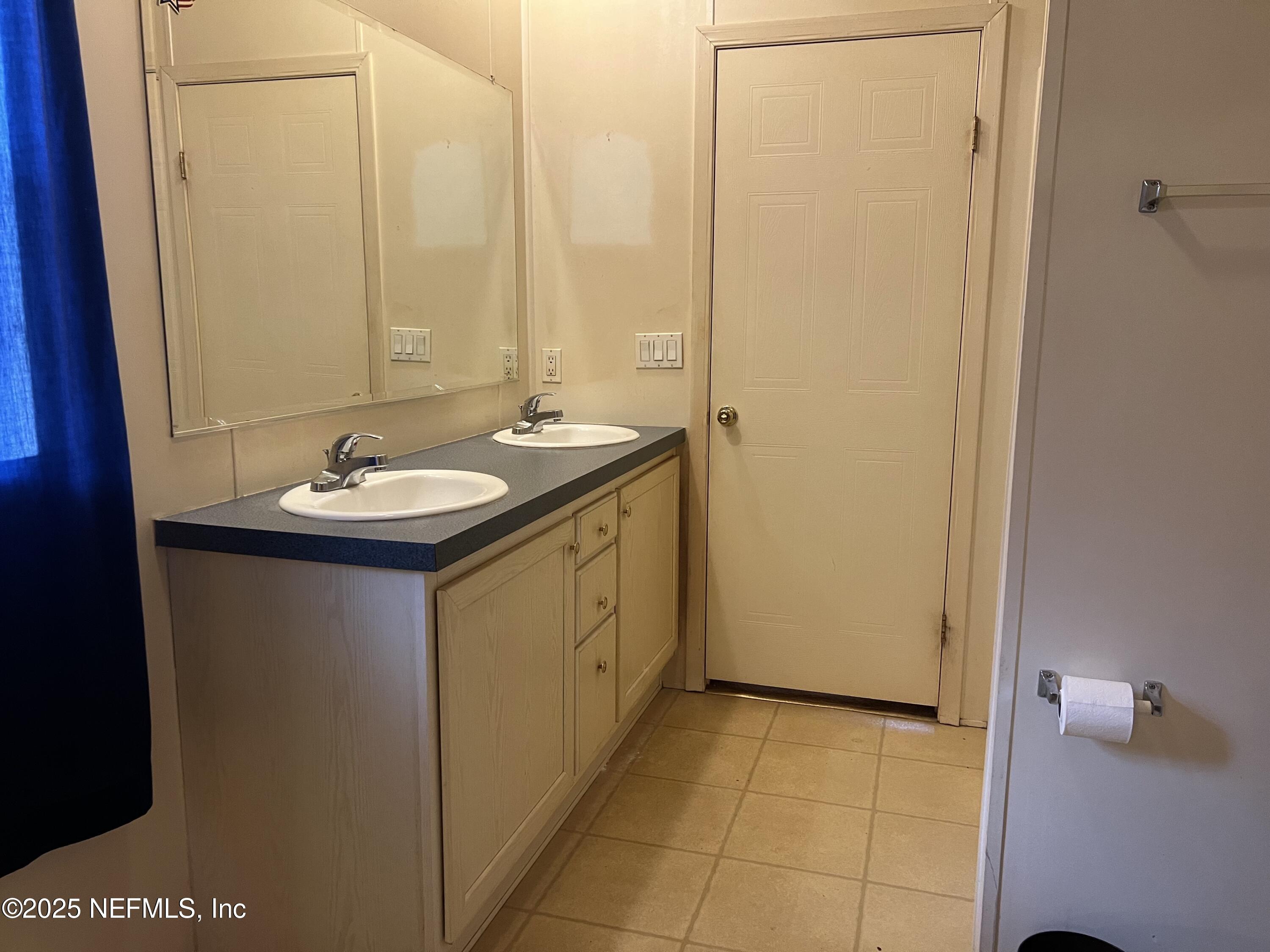 159 Keystone Road Palatka, FL 32177 - Photo 24 of 36 a bathroom with a sink and a mirror