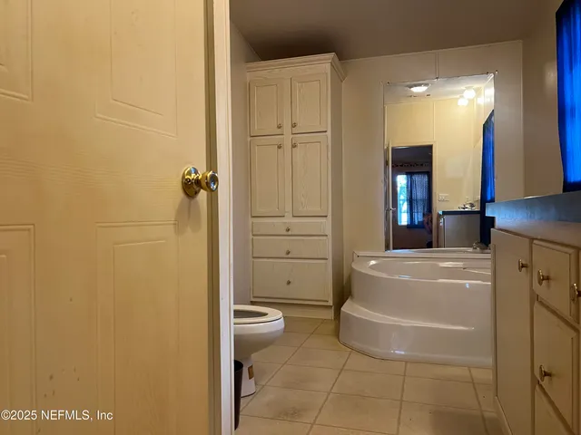 a bathroom with a glass shower door
