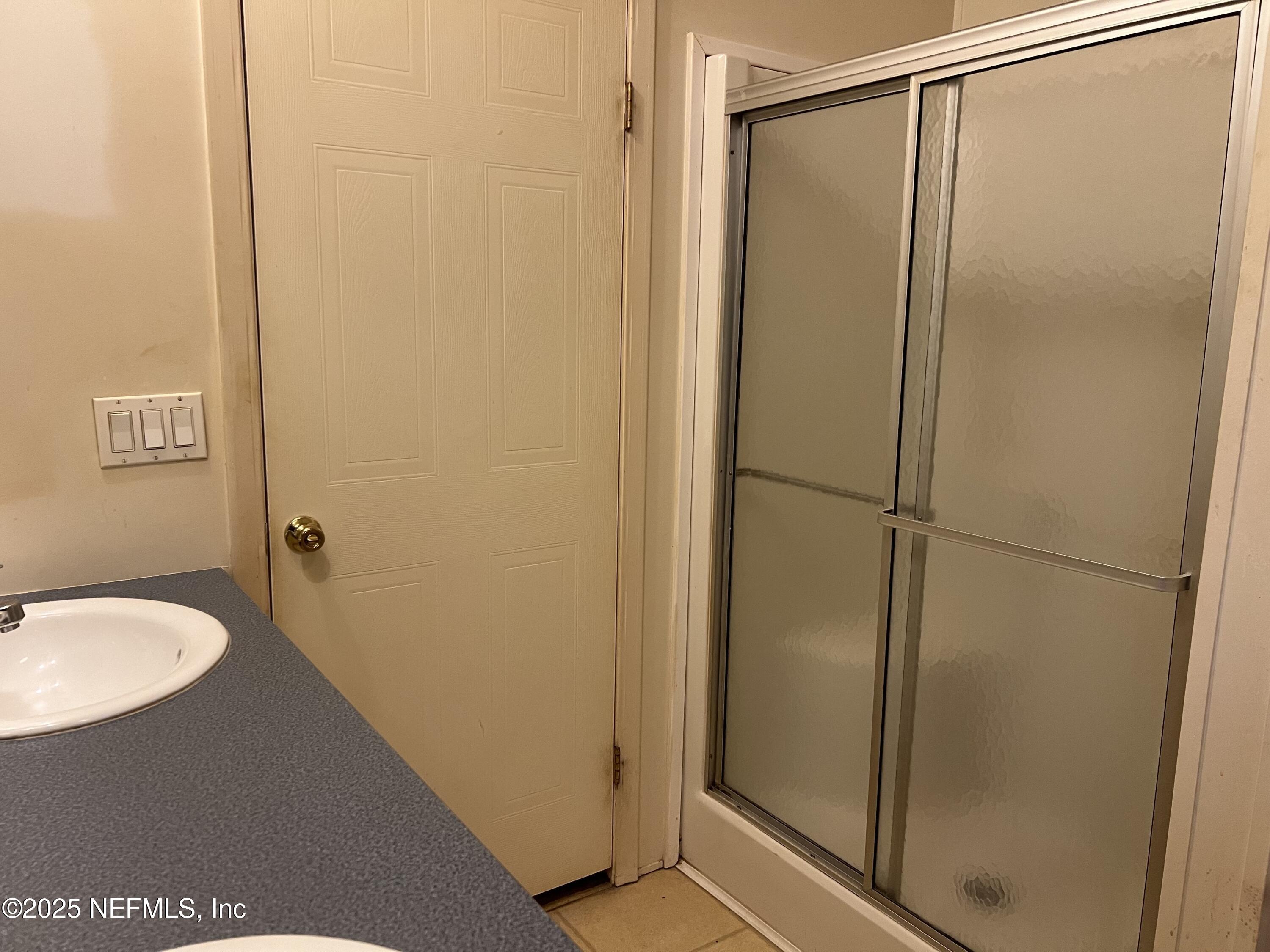 159 Keystone Road Palatka, FL 32177 - Photo 26 of 36 a bathroom with a glass shower door