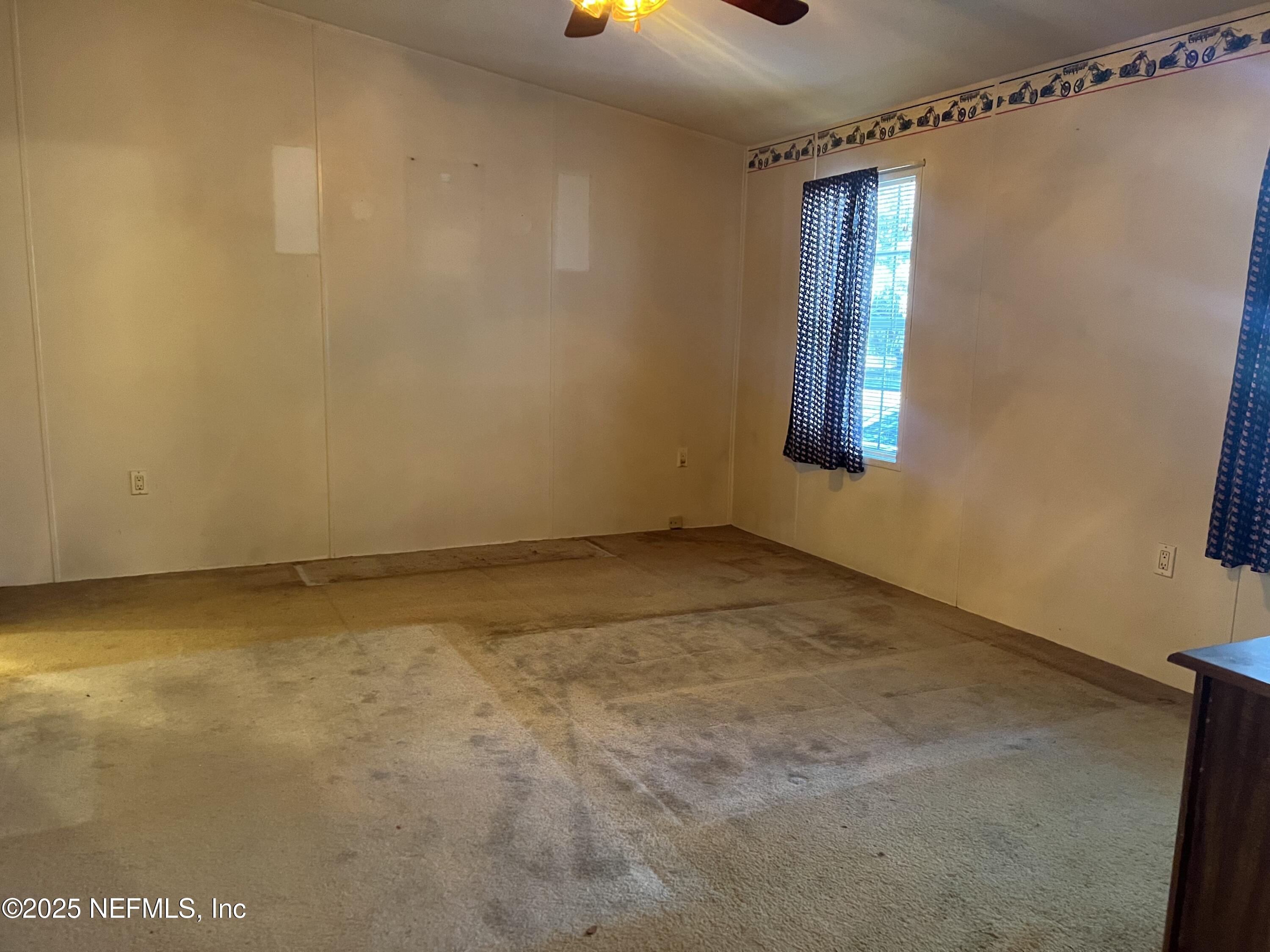 159 Keystone Road Palatka, FL 32177 - Photo 27 of 36 a view of an empty room with a window