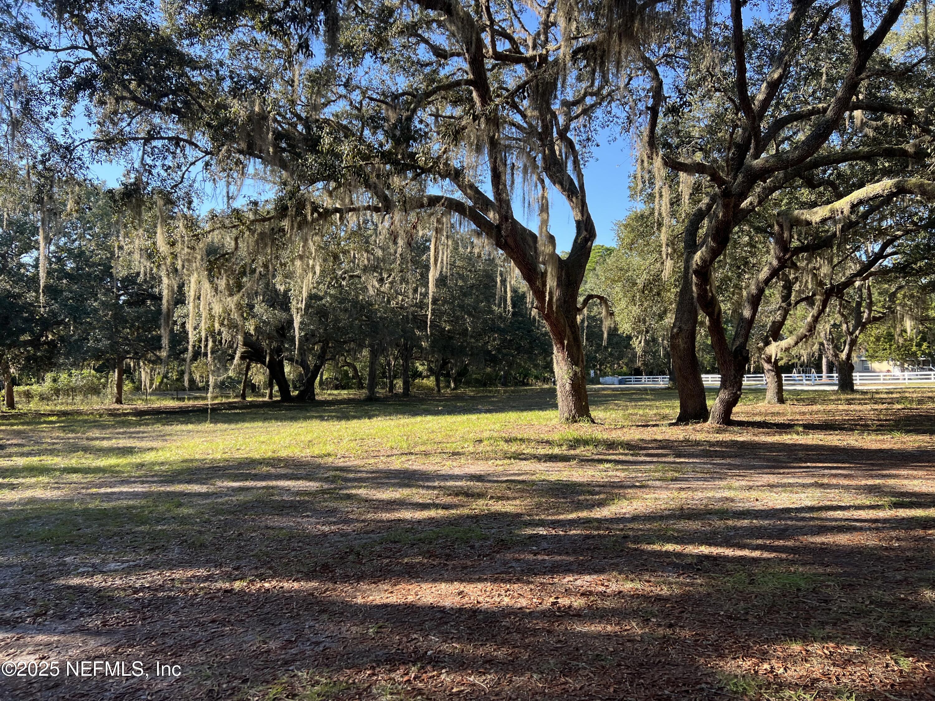 159 Keystone Road Palatka, FL 32177 - Photo 5 of 36 a view of a swimming pool with an outdoor space and seating