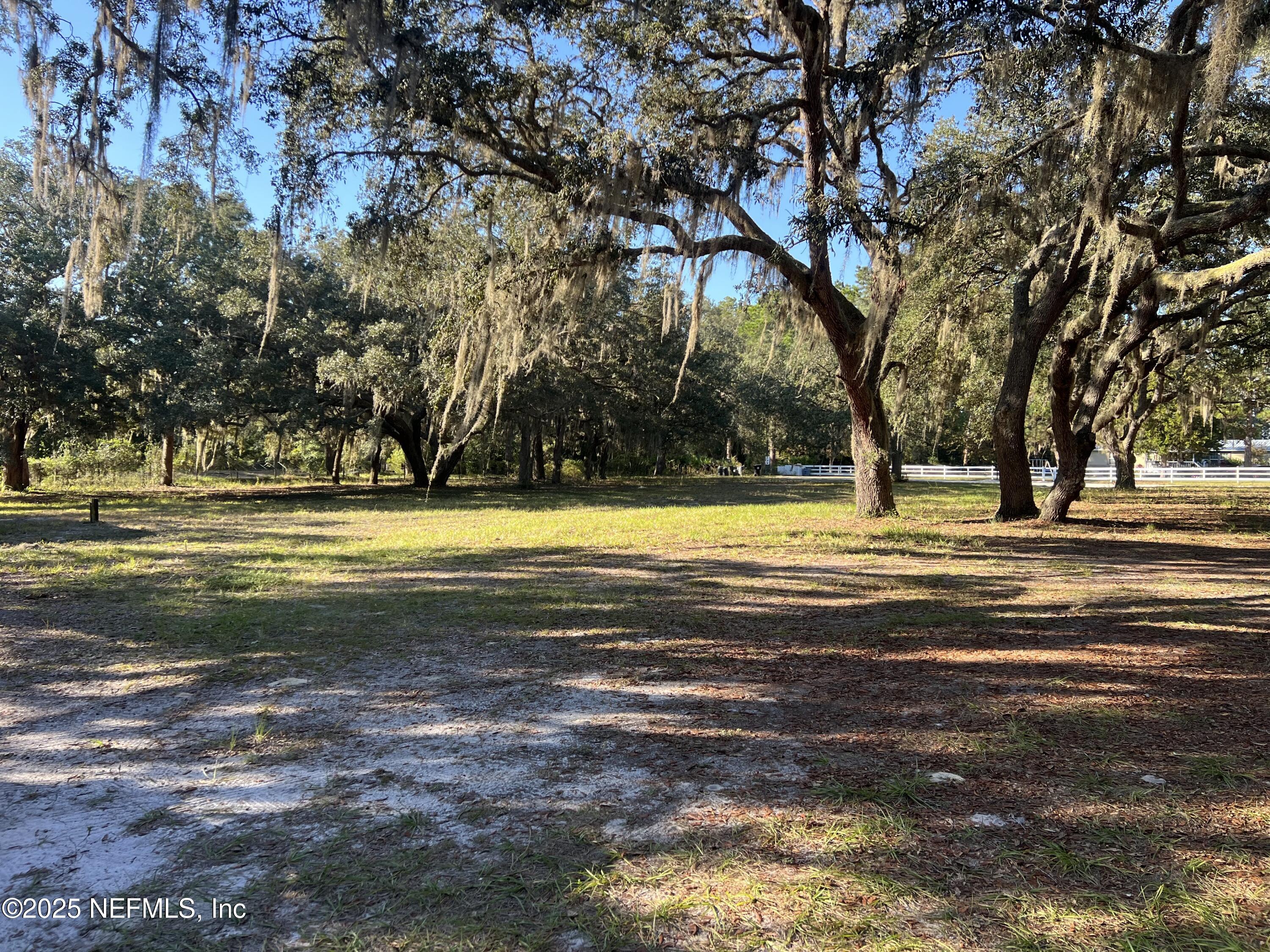 159 Keystone Road Palatka, FL 32177 - Photo 7 of 36 a view of a swimming pool with an outdoor space and seating area