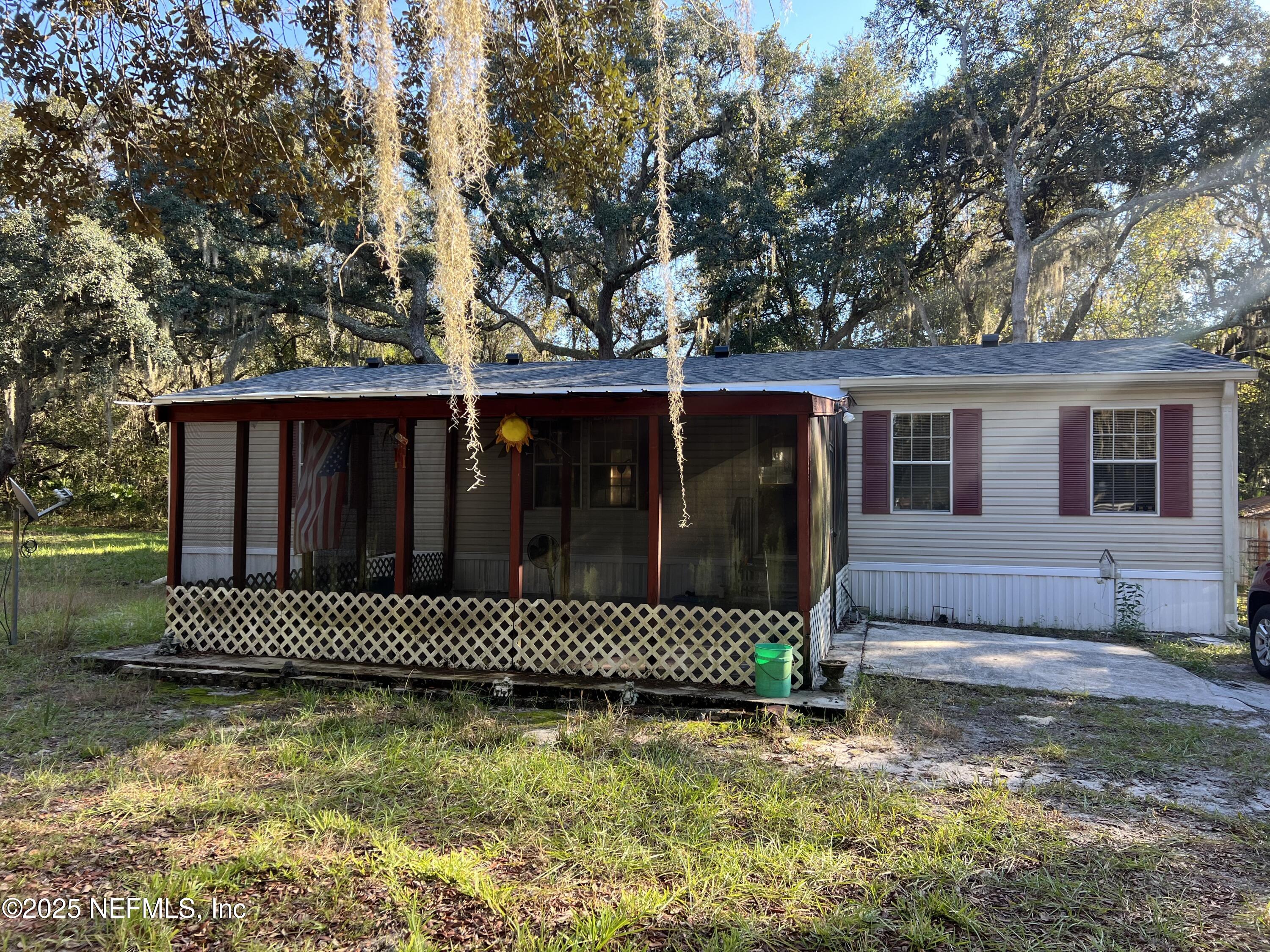 159 Keystone Road Palatka, FL 32177 - Photo 10 of 36 a front view of a house with a yard