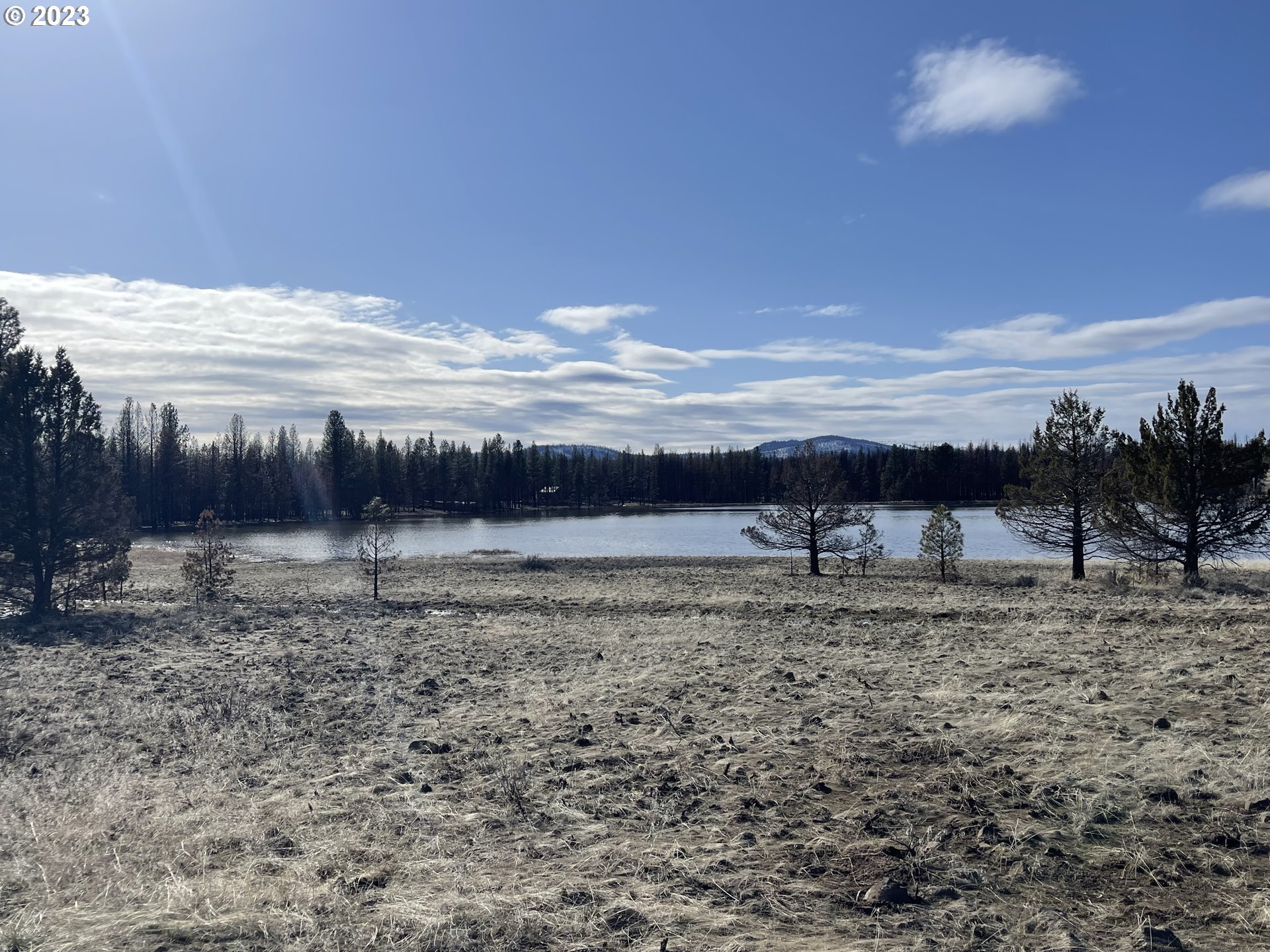 0 Loyd Low Trail Bly, OR 97622 - Photo 14 of 21 a view of a dry yard with wooden fence