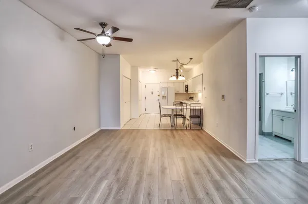 a view of wooden floor and windows in a room