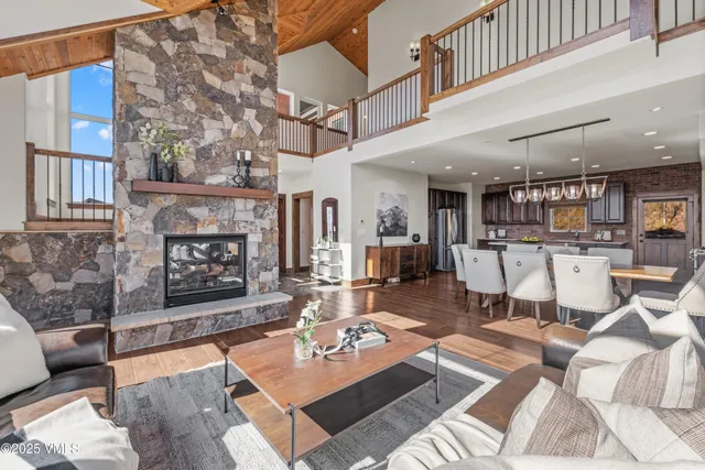 a living room with furniture and a table