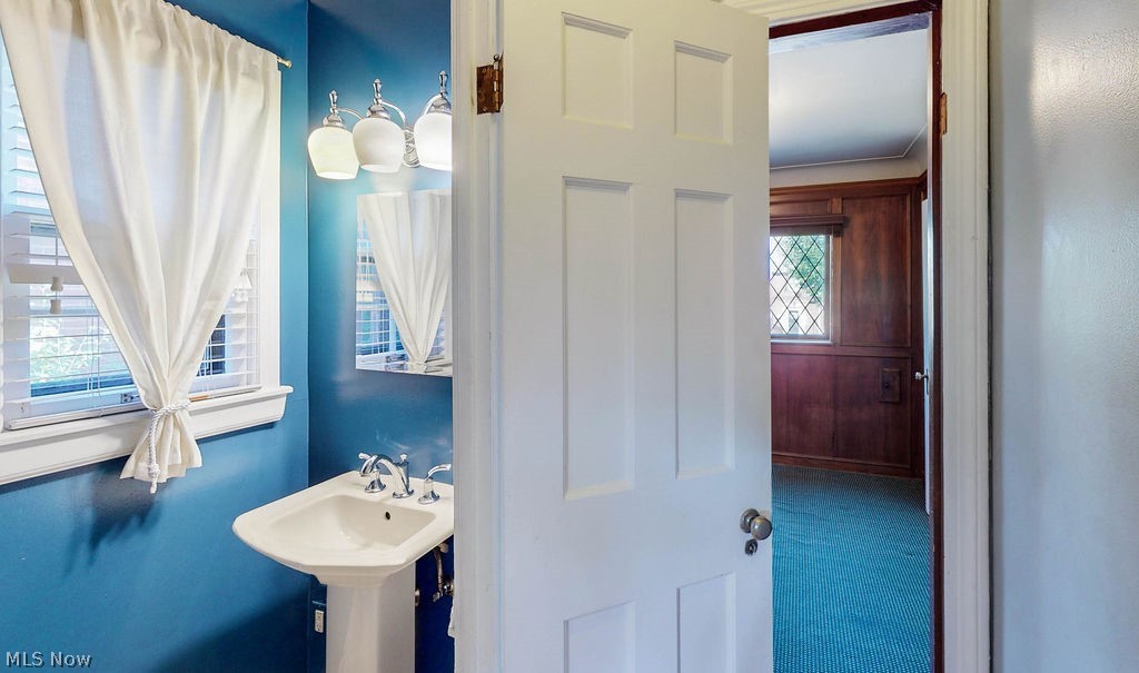 2555 Channing Road Cleveland, OH 44118 - Photo 10 of 24 Powder room; also shows view into the library.