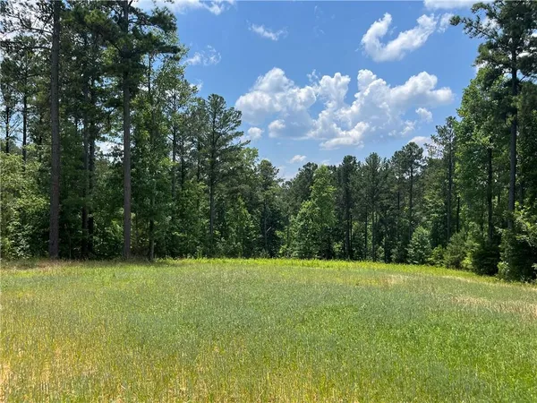 a view of patio with a yard