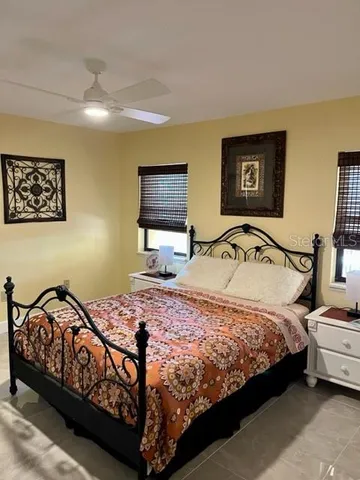 a bedroom with a bed and dresser