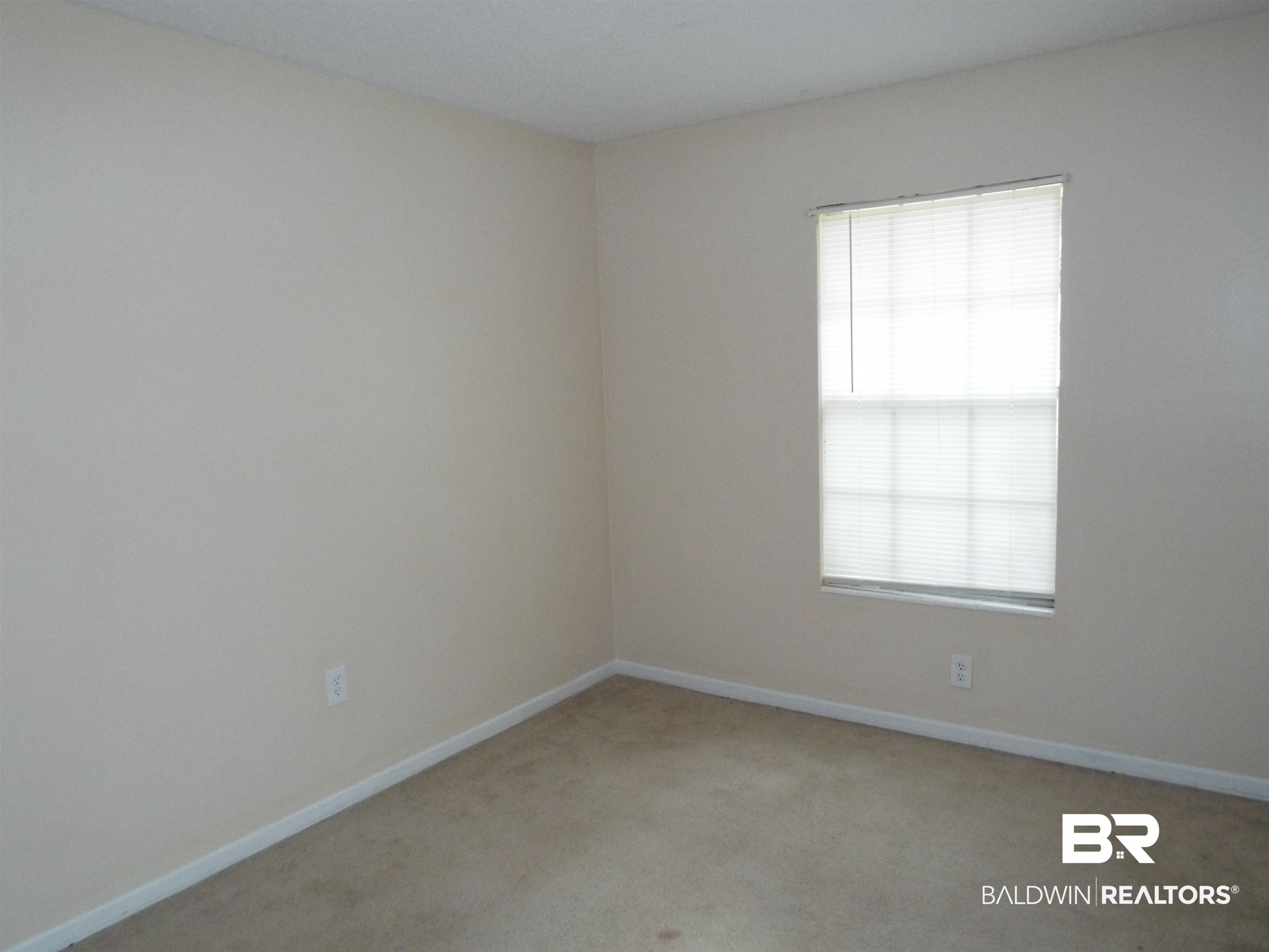 604 Southern Way Spanish Fort, AL 36527 - Photo 8 of 13 Empty room featuring light carpet