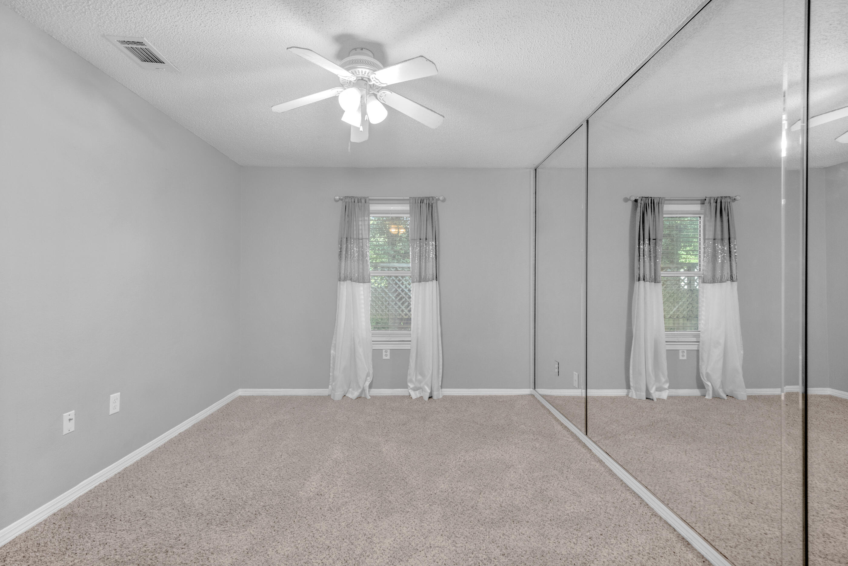 809 Valley Road Crestview, FL 32539 - Photo 14 of 24 an empty room with chandelier fan