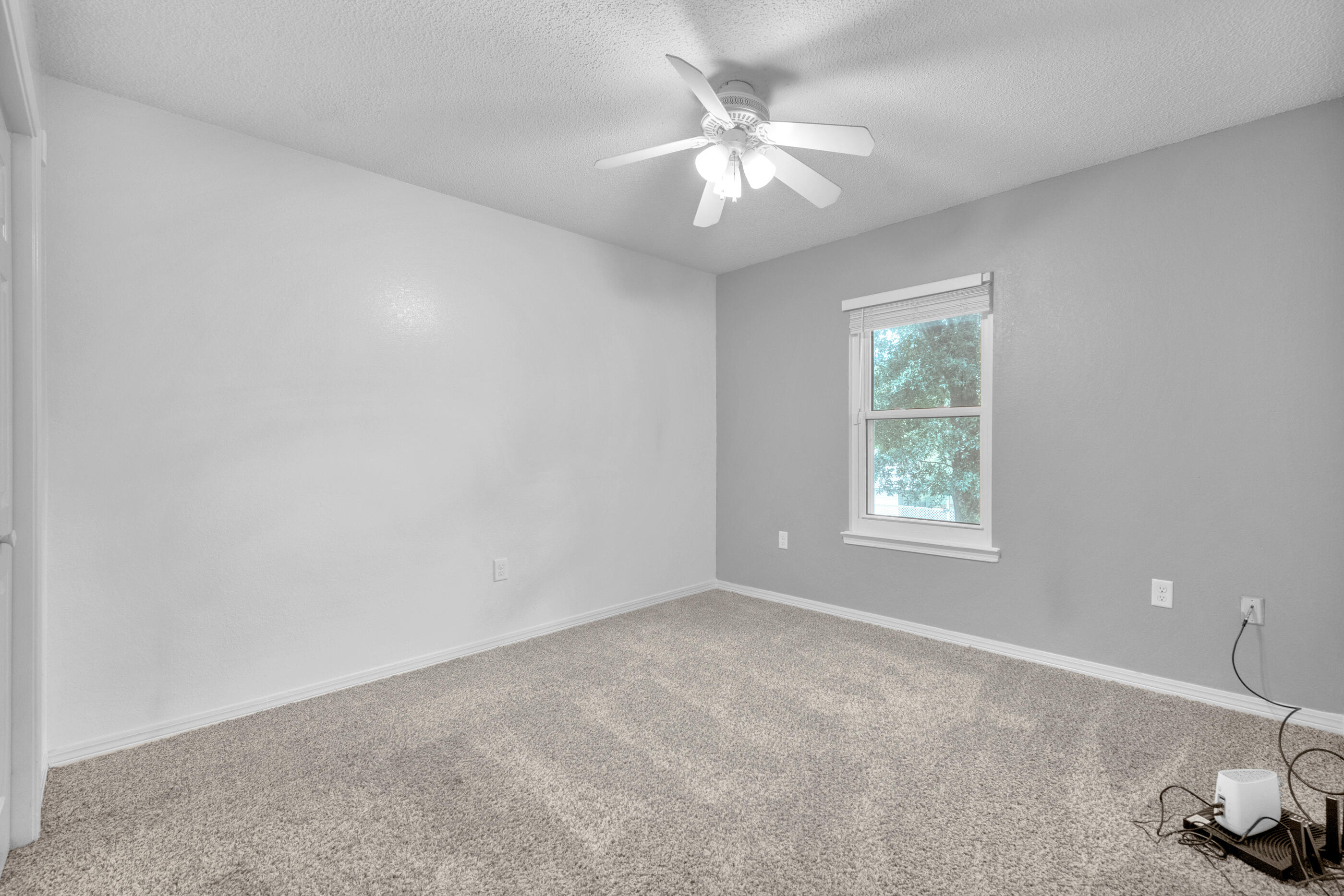 809 Valley Road Crestview, FL 32539 - Photo 21 of 24 an empty room with windows and fan