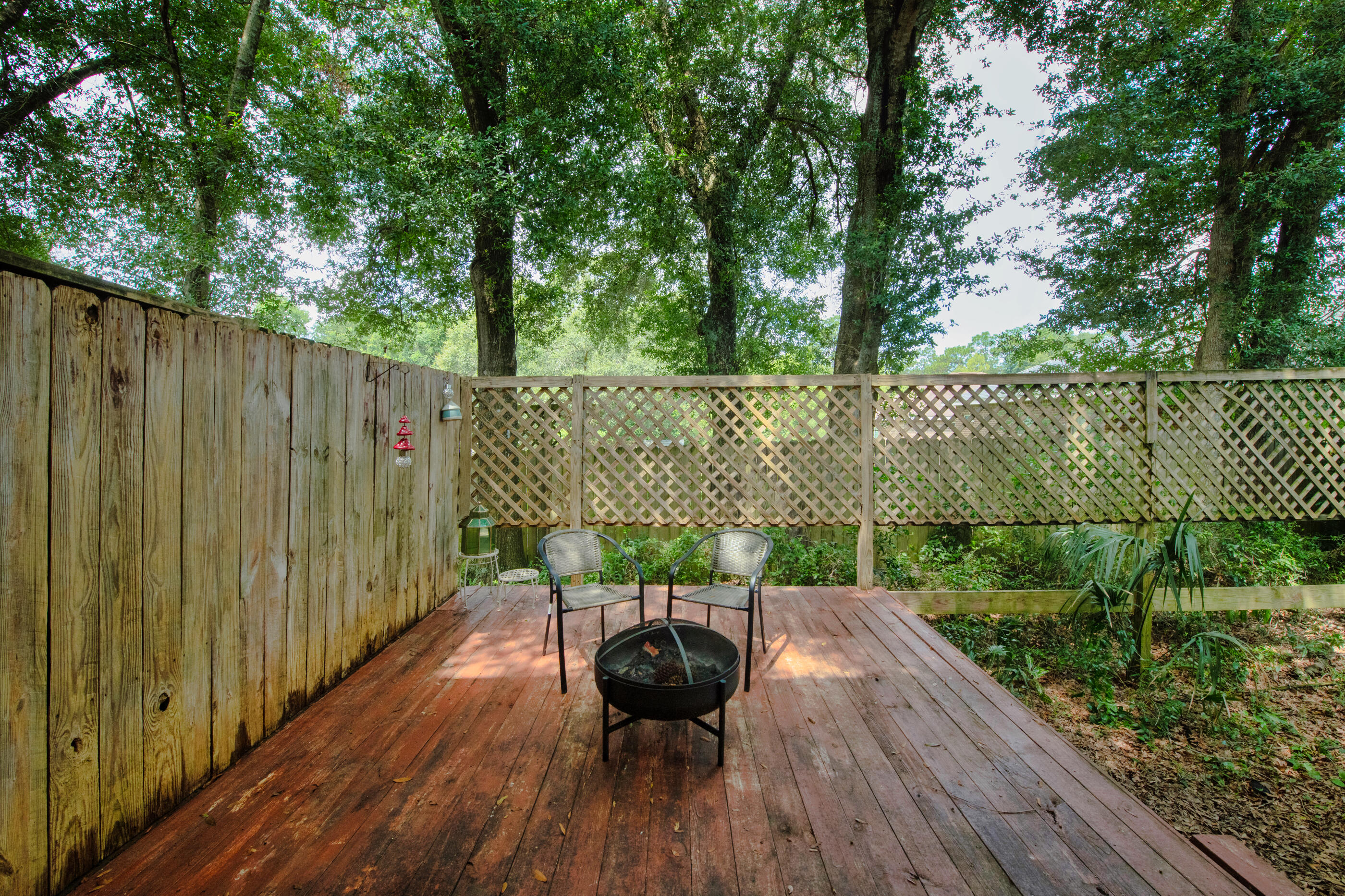 809 Valley Road Crestview, FL 32539 - Photo 22 of 24 a view of balcony with wooden floor and outdoor seating