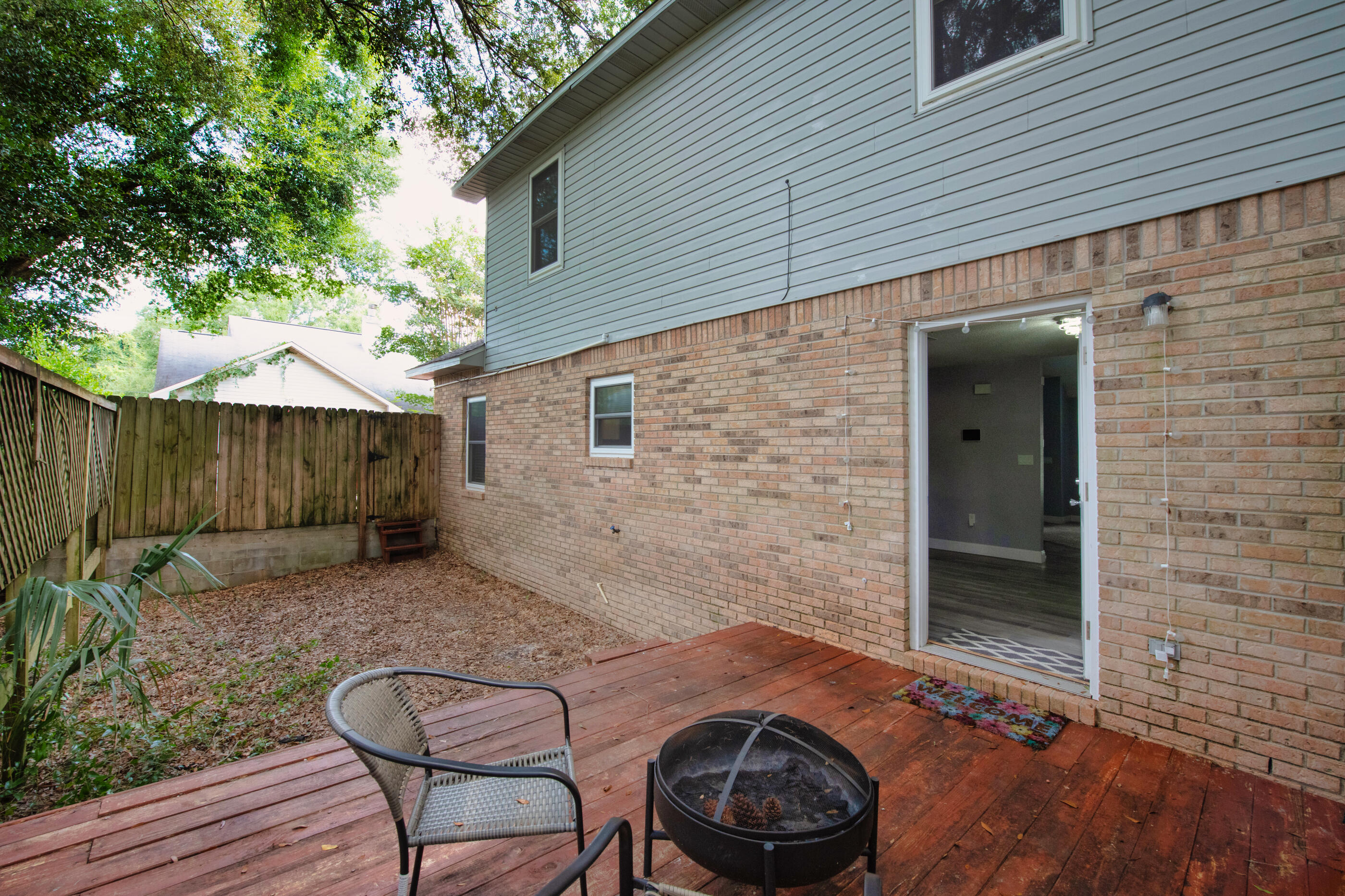 809 Valley Road Crestview, FL 32539 - Photo 23 of 24 a backyard of a house with seating space