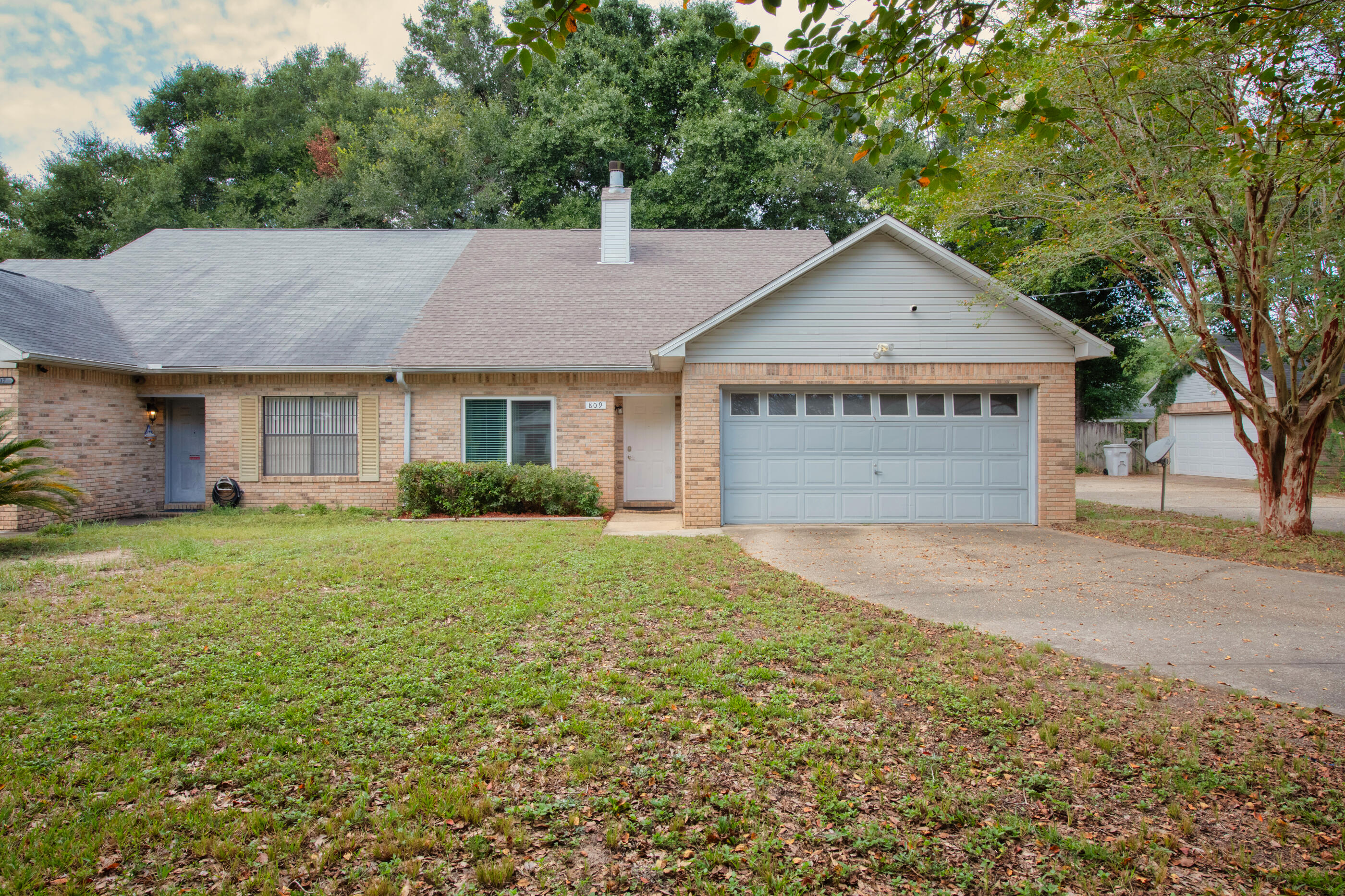 809 Valley Road Crestview, FL 32539 - Photo 6 of 24 a view of a house with a yard and garage