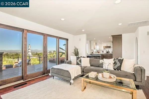a living room with furniture and a large window