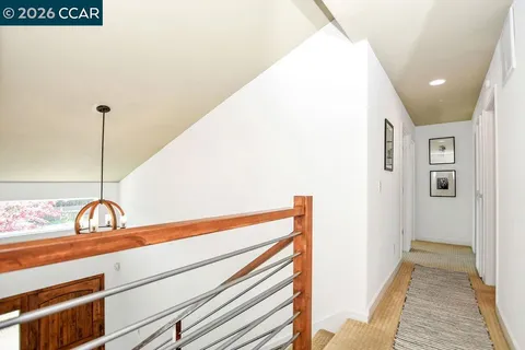 a view of a livingroom with furniture and kitchen view