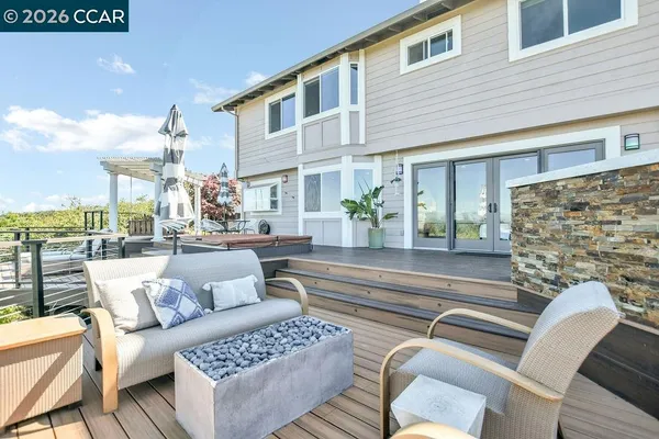 a view of a patio with couches and potted plants