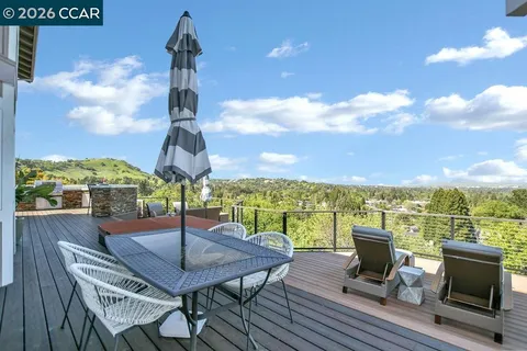 a view of a terrace with furniture and a table