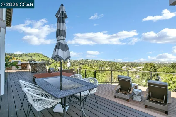 a view of a terrace with furniture and a table