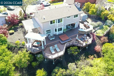a aerial view of a house with a yard and garden