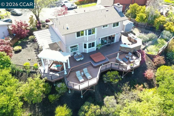 a aerial view of a house with a yard and garden