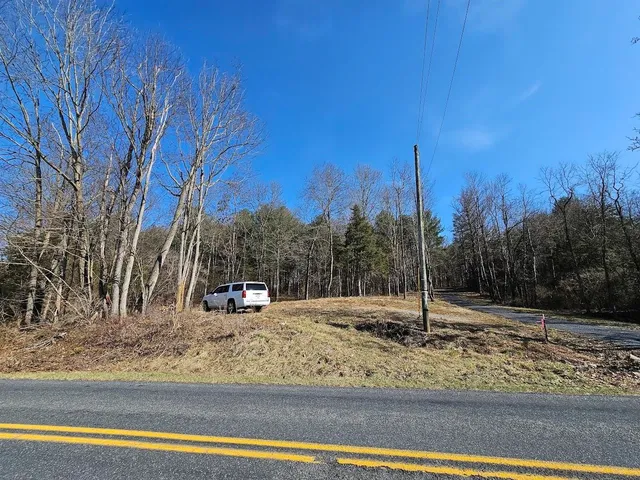 a view of a backyard of the house
