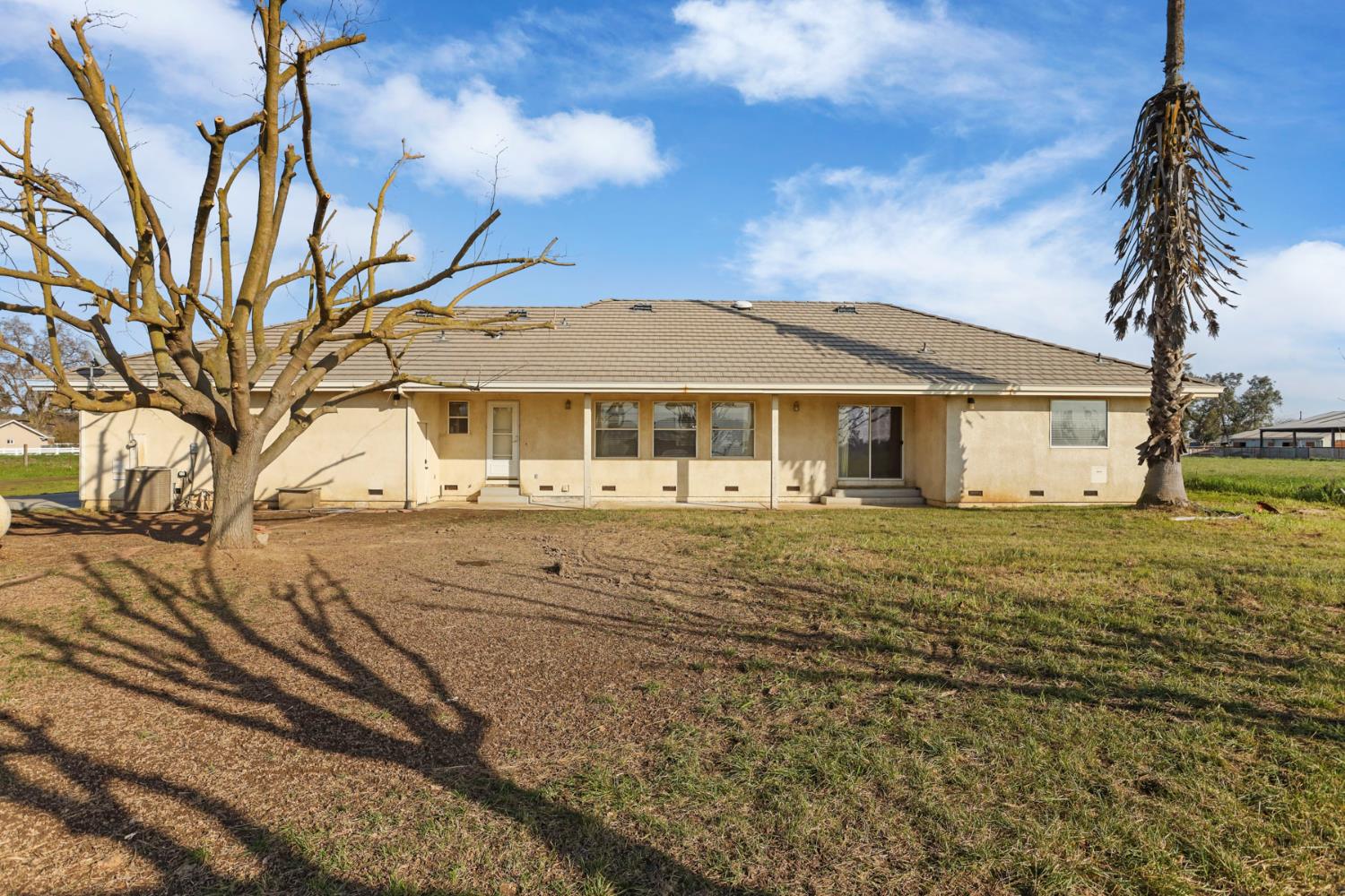 24257 North Pearl Road Acampo, CA 95220 - Photo 11 of 41 a front view of a house with a yard