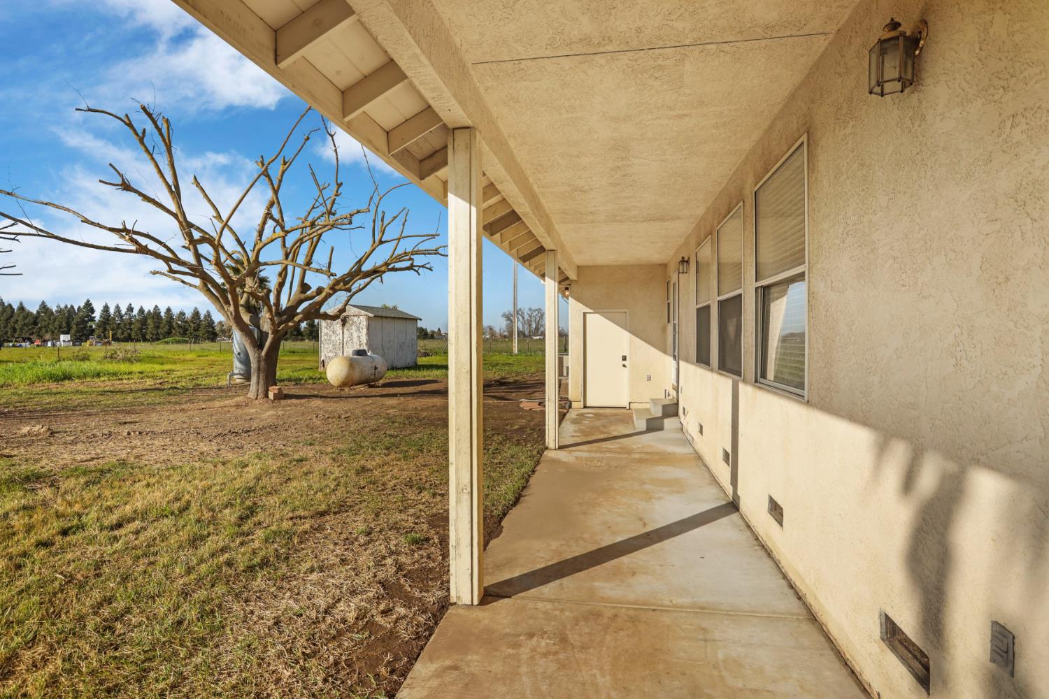 24257 North Pearl Road Acampo, CA 95220 - Photo 14 of 41 a view of a pathway of a building