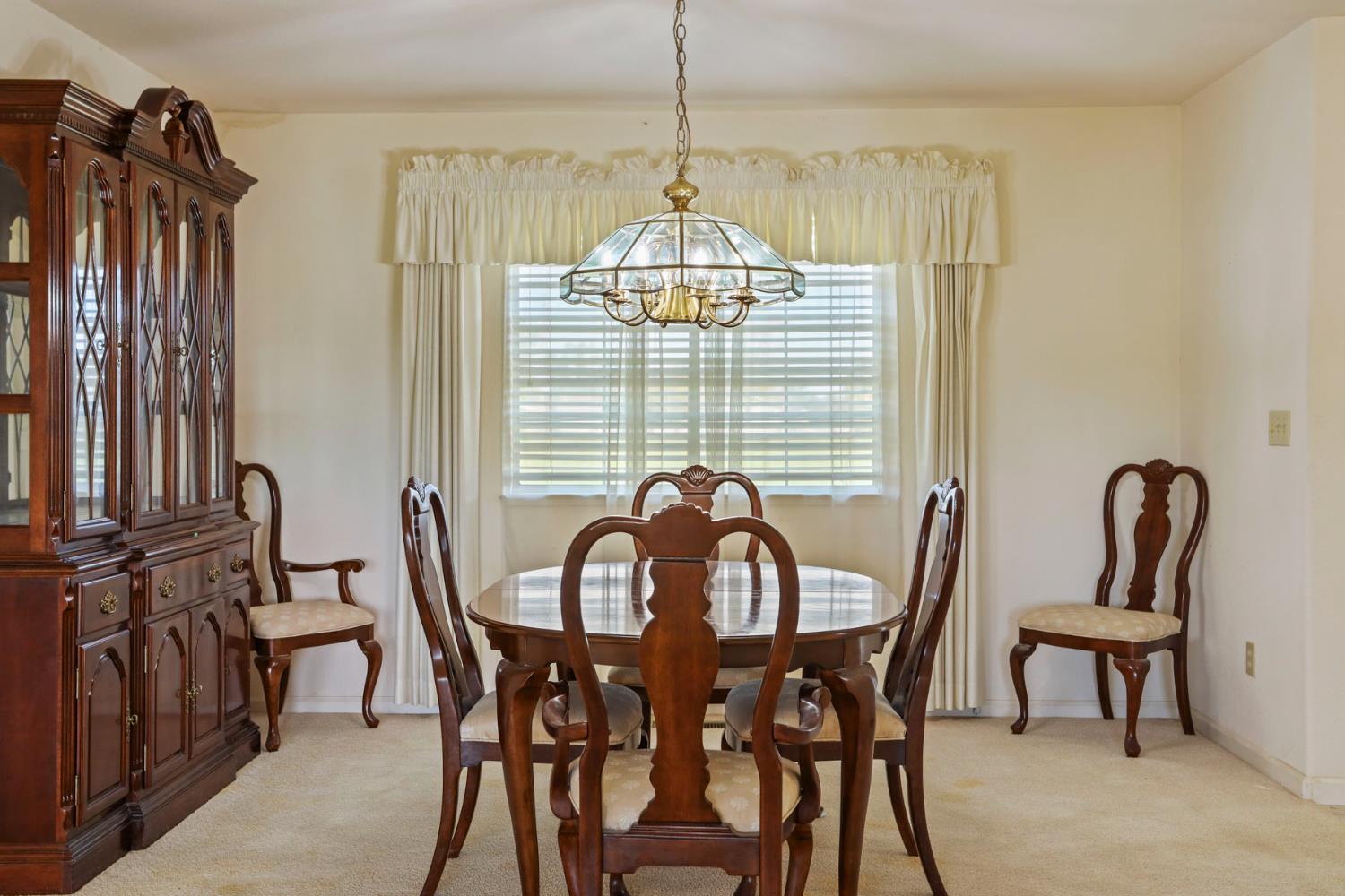 24257 North Pearl Road Acampo, CA 95220 - Photo 19 of 41 a view of a dining room with furniture window and outside view