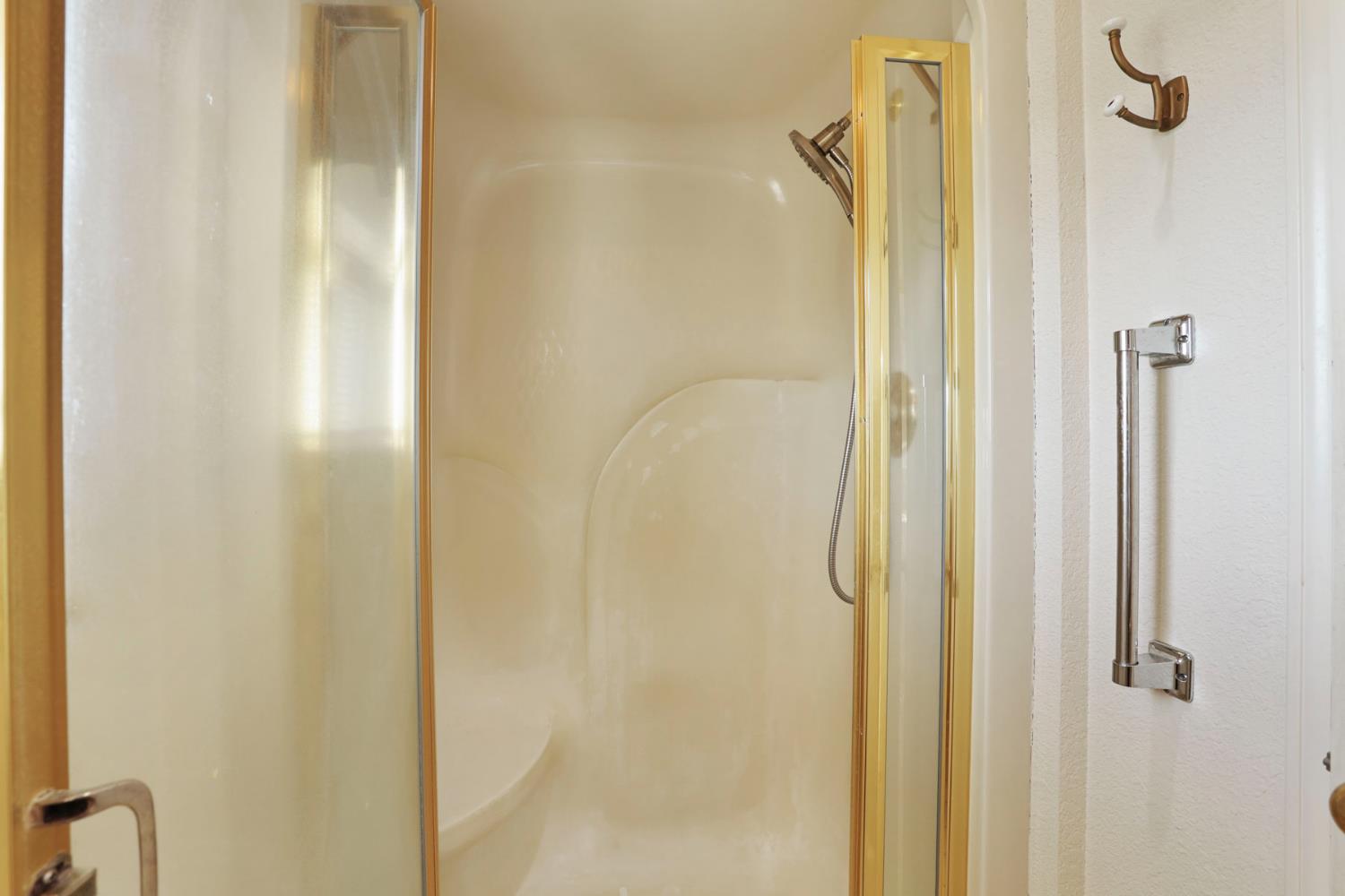 24257 North Pearl Road Acampo, CA 95220 - Photo 27 of 41 a bathroom with a glass shower door