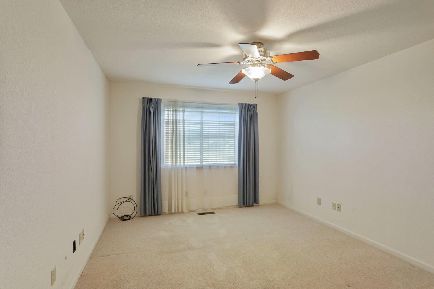 24257 North Pearl Road Acampo, CA 95220 - Photo 38 of 41 an empty room with windows and fan