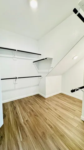 a bathroom with a granite countertop sink toilet and bathtub
