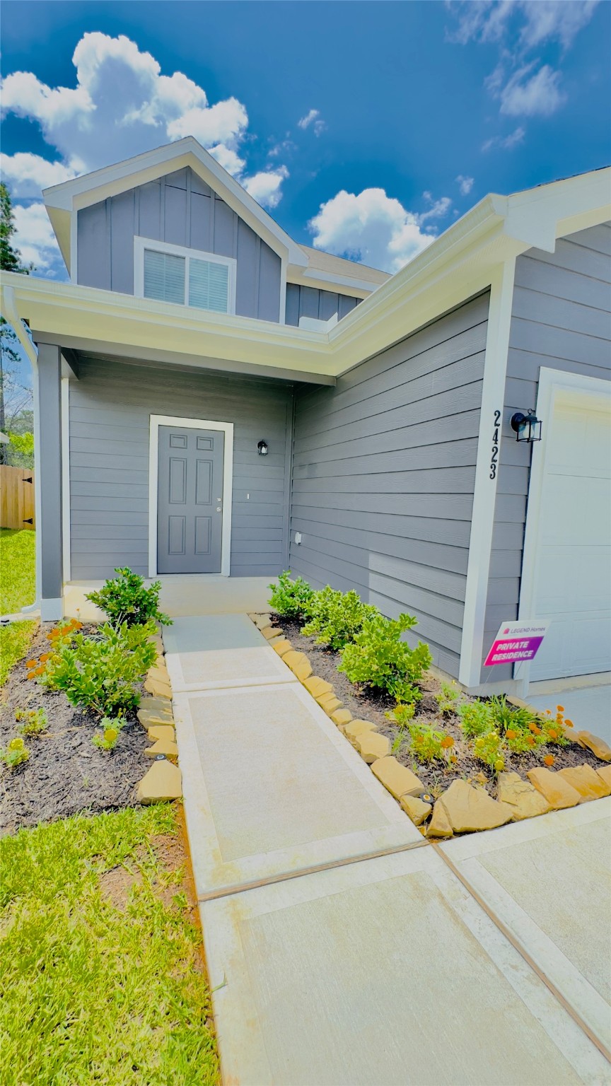 2423 Bluefish Court Conroe, TX 77384 - Photo 2 of 30 a front view of a house