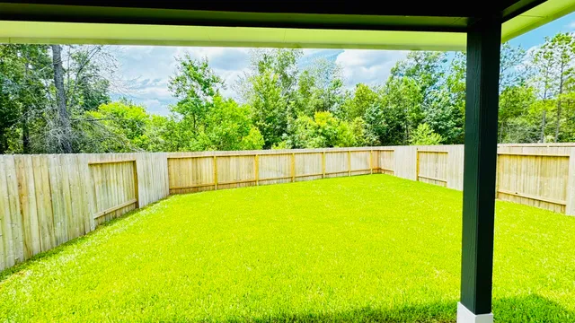a view of swimming pool with a yard