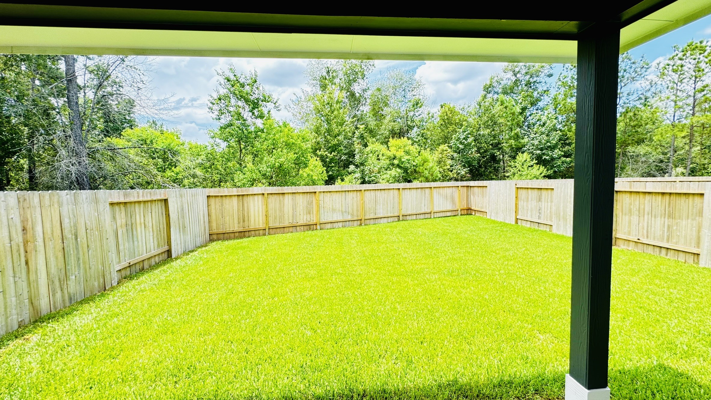 2423 Bluefish Court Conroe, TX 77384 - Photo 27 of 30 a view of a swimming pool with a outdoor space