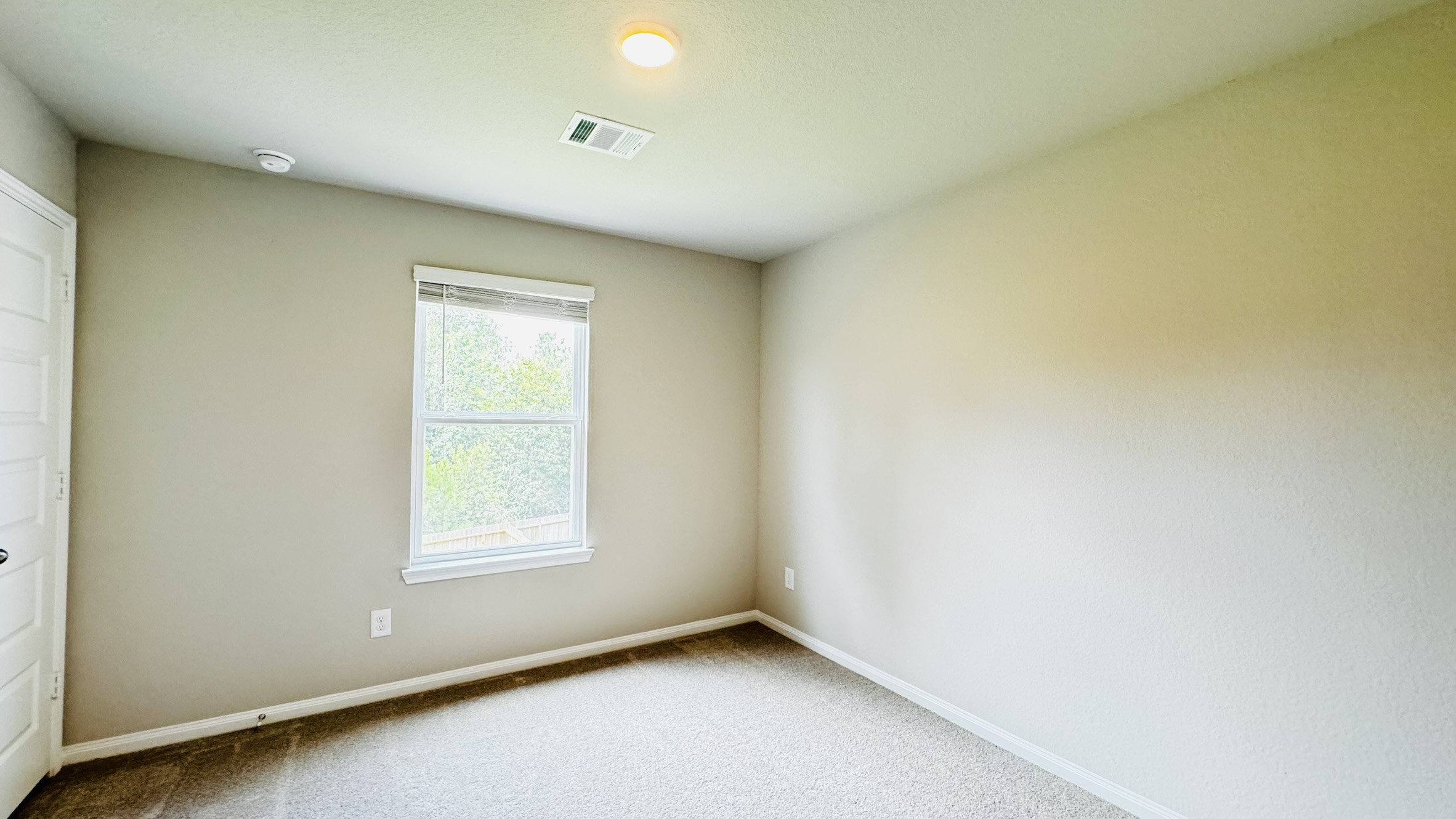 2423 Bluefish Court Conroe, TX 77384 - Photo 10 of 30 an empty room with a window