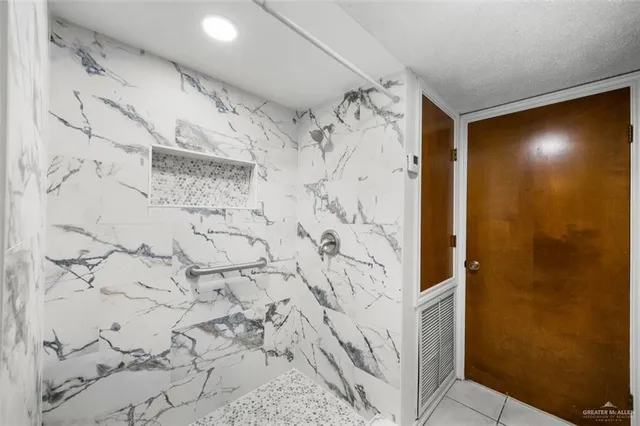a bathroom with a shower and a shower curtain
