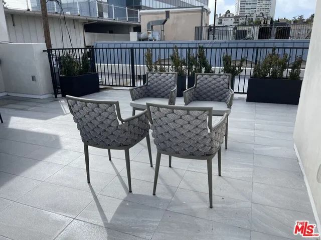 a view of balcony with furniture