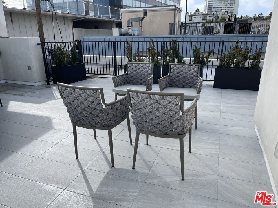 9842 Vidor Drive, Unit 201 Los Angeles, CA 90035 - Photo 18 of 20 a view of balcony with furniture