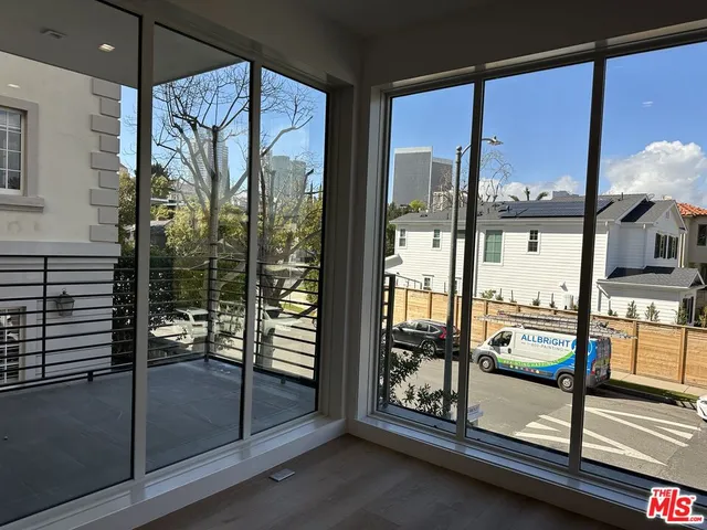 a room with natural light and windows