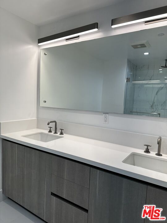 9842 Vidor Drive, Unit 201 Los Angeles, CA 90035 - Photo 7 of 20 a close view of sink and mirror