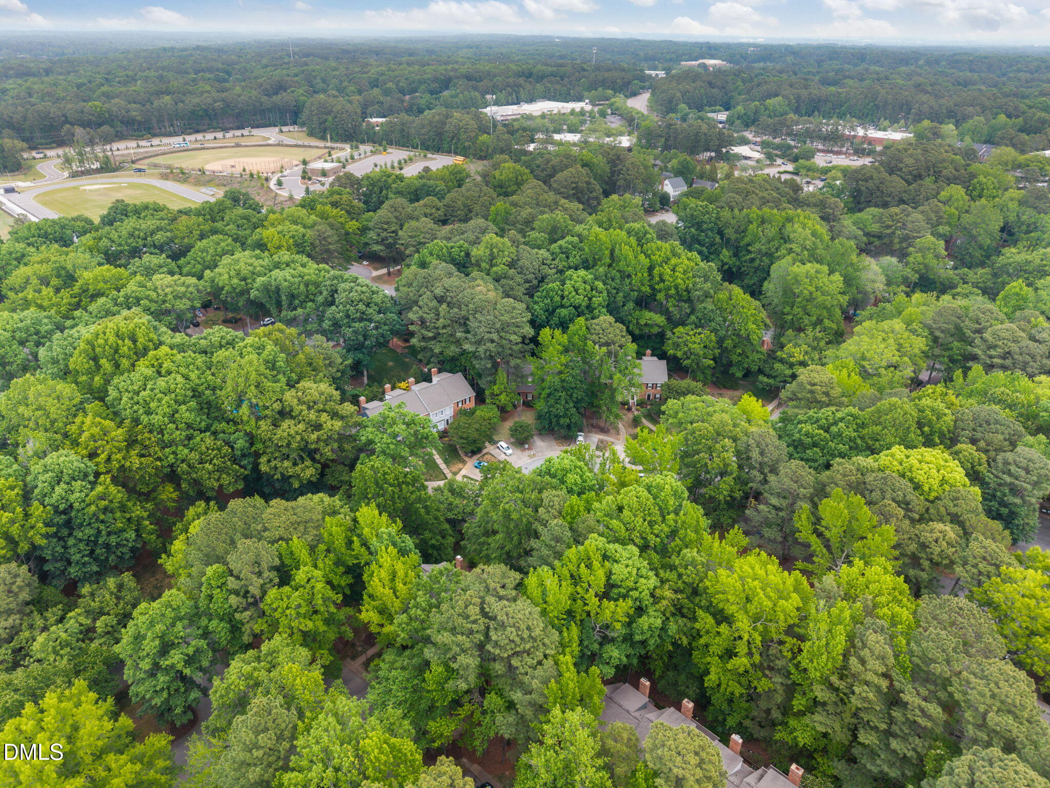 562 Weathergreen Drive Raleigh, NC 27615 - Photo 46 of 47 a view of a lake with a city