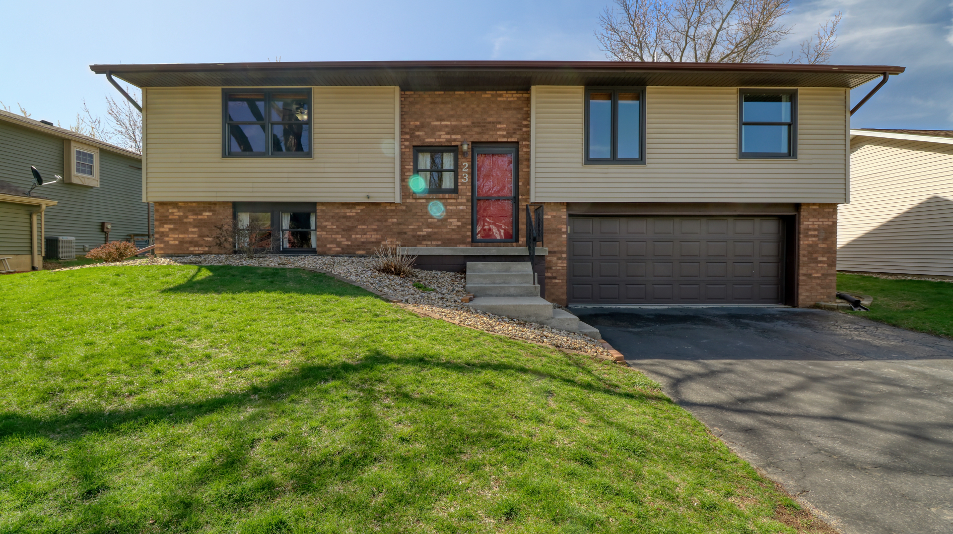 23 Cedar Court Bloomington, IL 61701 - Photo 1 of 36 a front view of a house with a yard