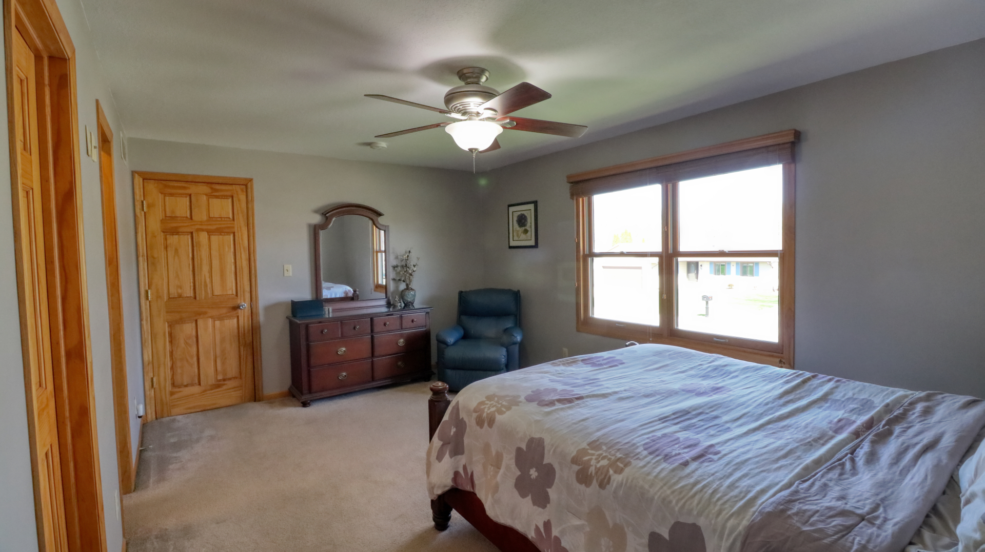 23 Cedar Court Bloomington, IL 61701 - Photo 14 of 36 a bedroom with a large bed and a chandelier fan