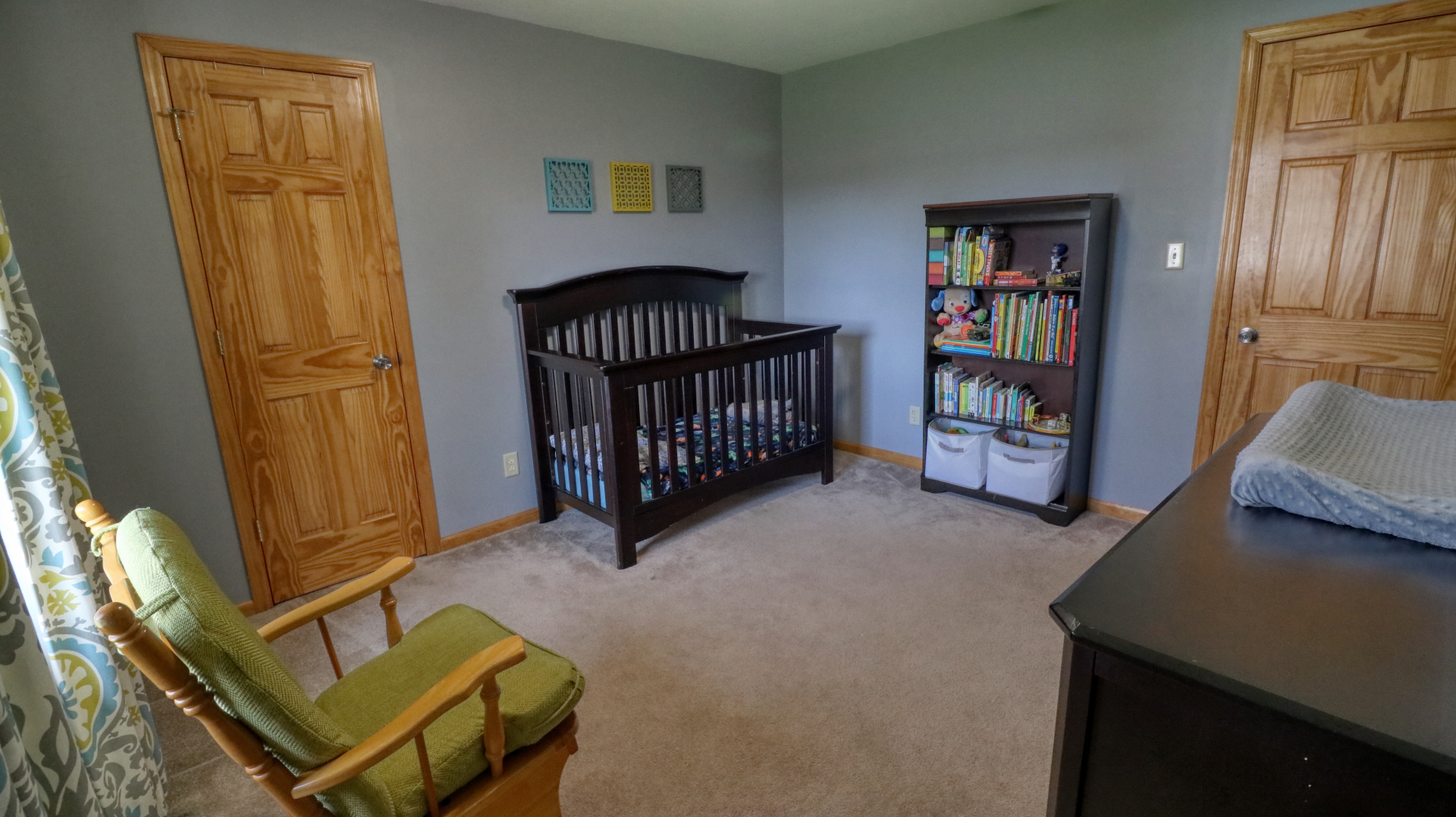 23 Cedar Court Bloomington, IL 61701 - Photo 16 of 36 a living room with furniture and a baby crib