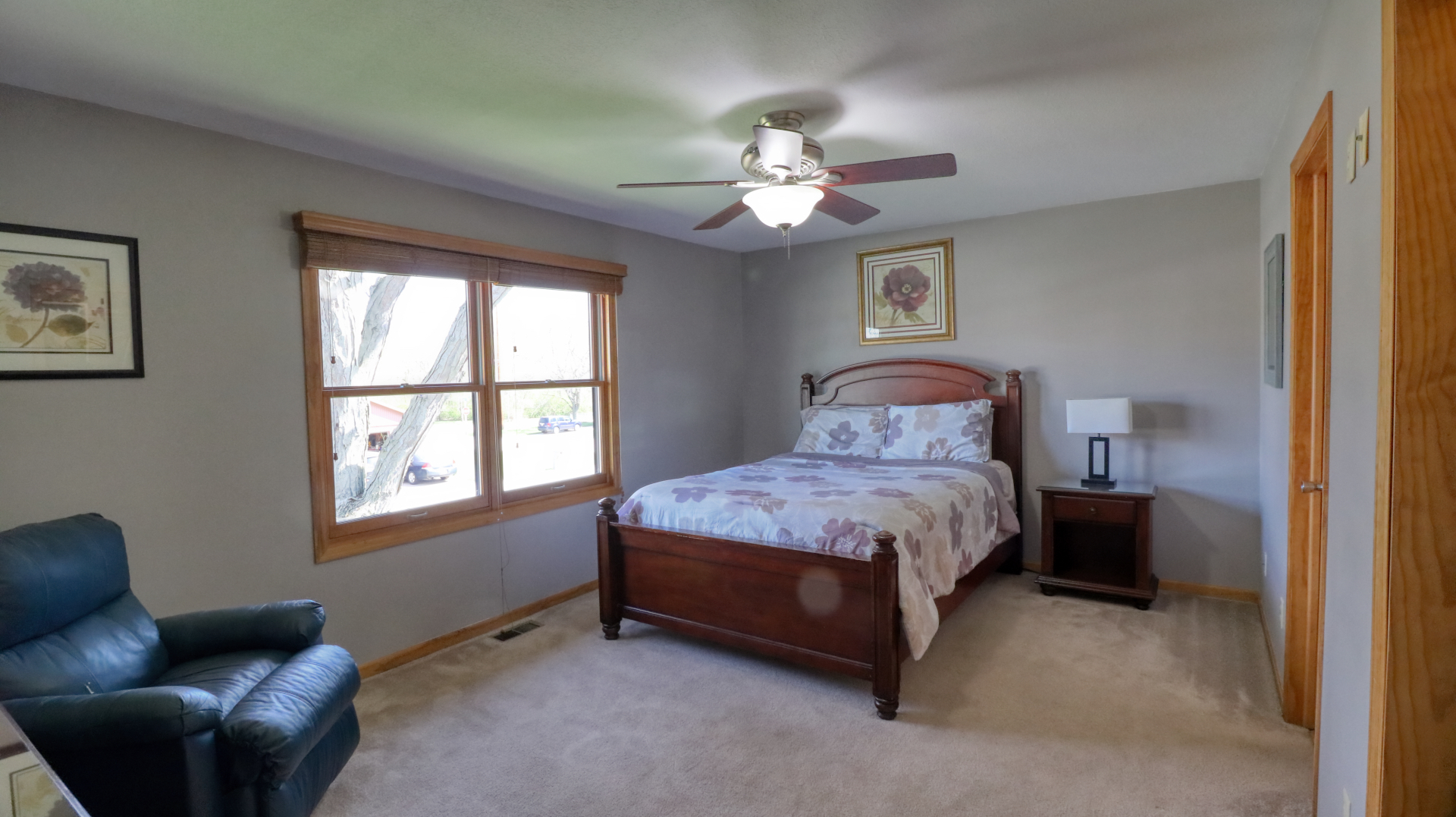 23 Cedar Court Bloomington, IL 61701 - Photo 22 of 36 a bedroom with a bed couch and a window
